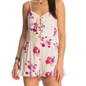 minkpink cream floral romper with lace up front